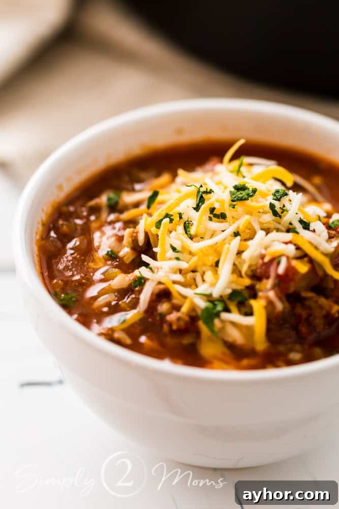 All-Meat Keto Chili Recipe (THM-S Friendly) 7 Bowl of all meat low carb chili garnished with shredded cheese