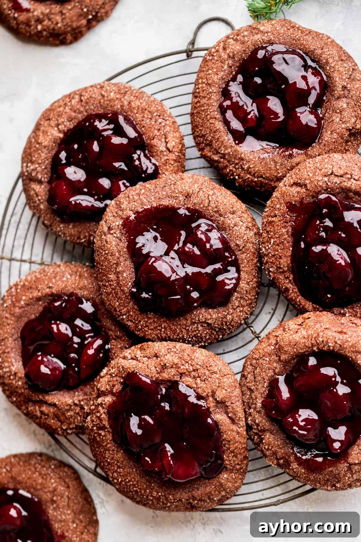 Cherry cookies on a wire rack.