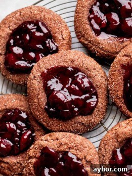 Cherry cookies on a wire rack.