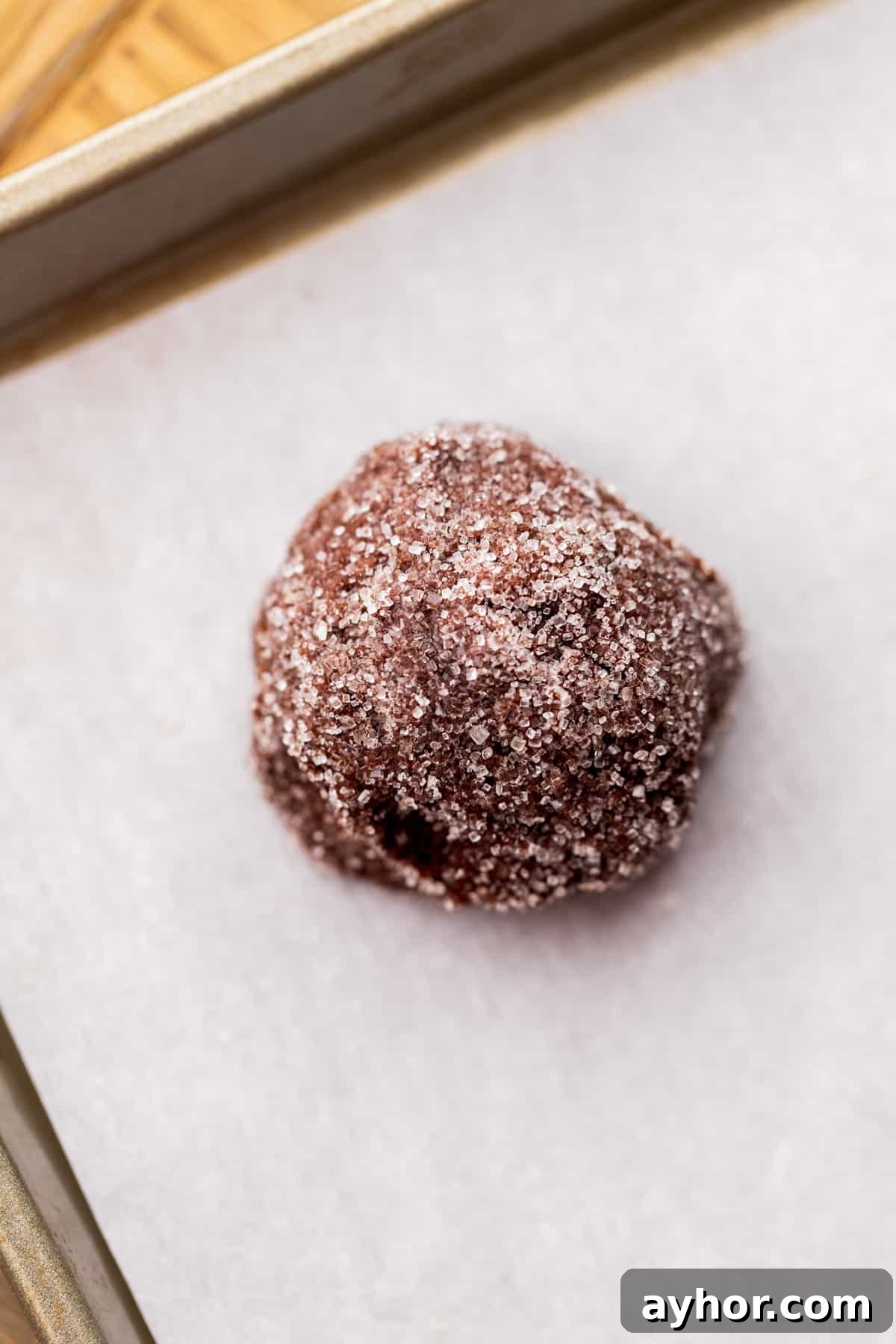 Cookie dough ball rolled in cane sugar.