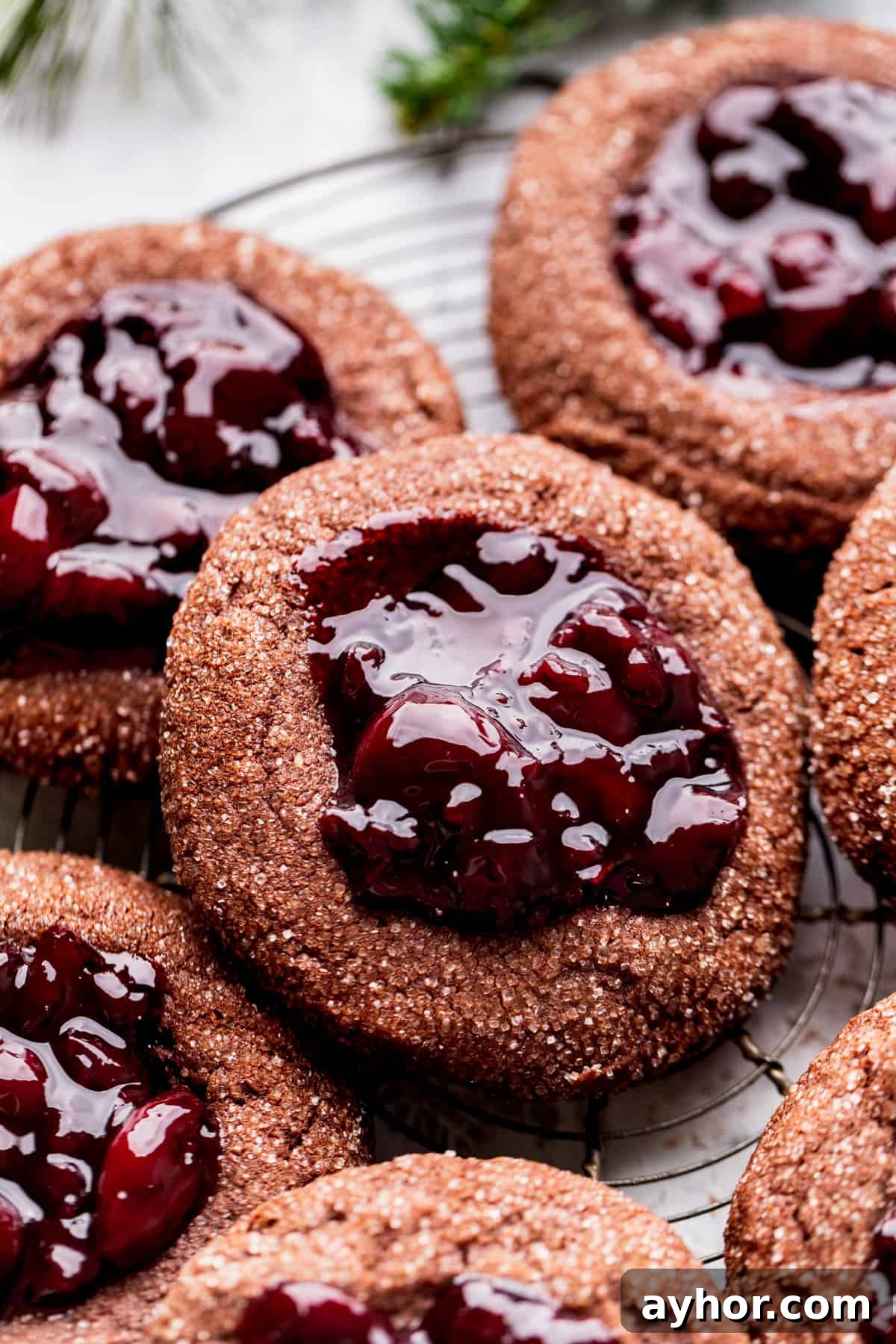 Cherry cookies on a wire rack.