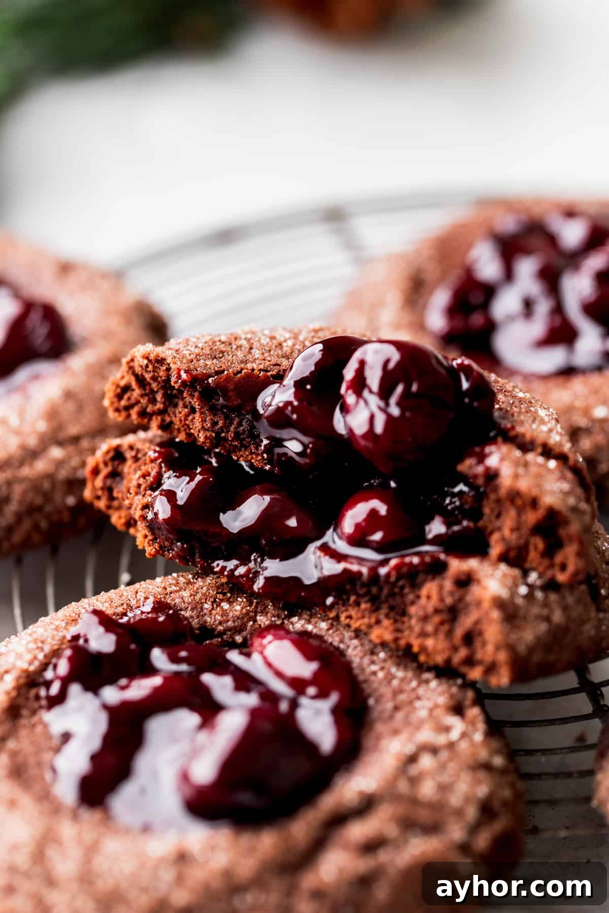 A cherry cookie split in half showing the inside.