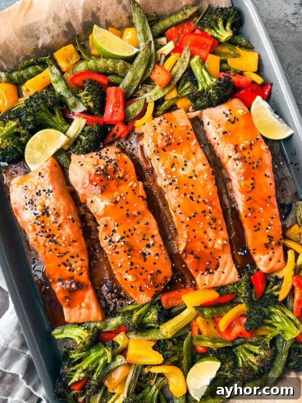 Teriyaki salmon with veggies on a sheet pan.