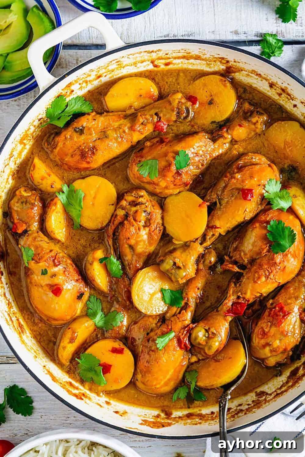 Close up shot of chicken drumsticks and potatoes stew Columbian-style.