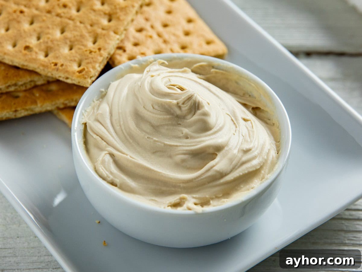 Cream Cheese Substitutes: 30+ Swaps for Any Recipe 6 Mascarpone cheese in a small white bowl with graham crackers in the background.