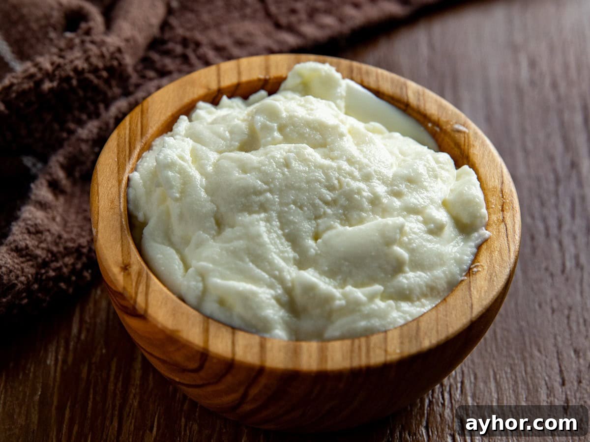 Cream Cheese Substitutes: 30+ Swaps for Any Recipe 7 Ricotta cheese in a small wooden bowl.