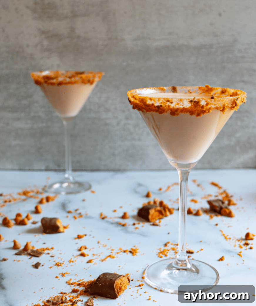 20+ Spooky Halloween Cocktail Recipes for Adults 11 Butterscotch halloween cocktail with crushed butterfinger candy.