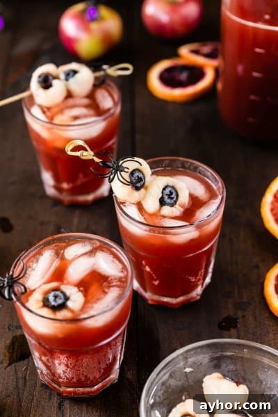 20+ Spooky Halloween Cocktail Recipes for Adults 22 Halloween punch with creepy eyeballs.