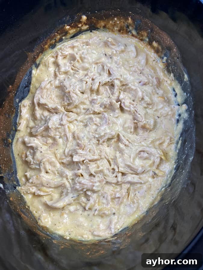 Slow Cooker Chicken with Bacon and Ranch Flavor 8 Creamy shredded chicken in a slow cooker with ranch and cream cheese.