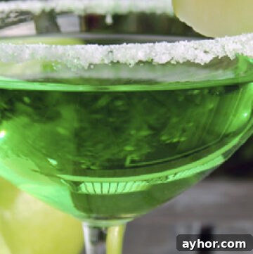 Homemade Apple Pie Moonshine Recipe – Smooth Spiced Apple Spirit 4 green apple martini in a martini glass