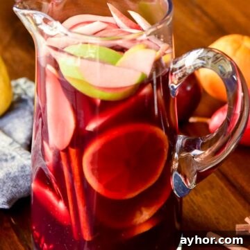 Homemade Apple Pie Moonshine Recipe – Smooth Spiced Apple Spirit 3 A pitcher of Christmas Sangria