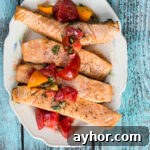 Grilled Salmon with Tomato-Caper Vinaigrette Recipe 5 Grilled salmon on a platter topped with tomato vinaigrette.