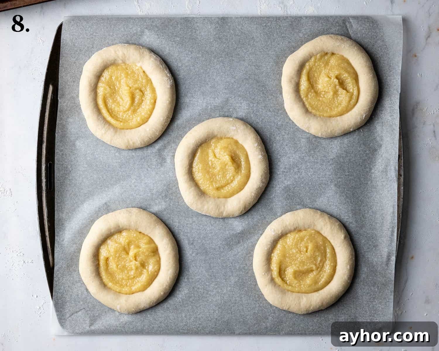 Vegan Rhubarb Frangipane Buns Recipe: Flaky Pastries with Almond Filling 12 Step 8, the buns filled with frangipane.