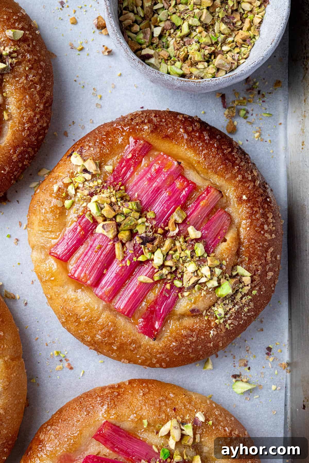Vegan Rhubarb Frangipane Buns Recipe: Flaky Pastries with Almond Filling 16 Close up of a vegan rhubarb frangipane bun.
