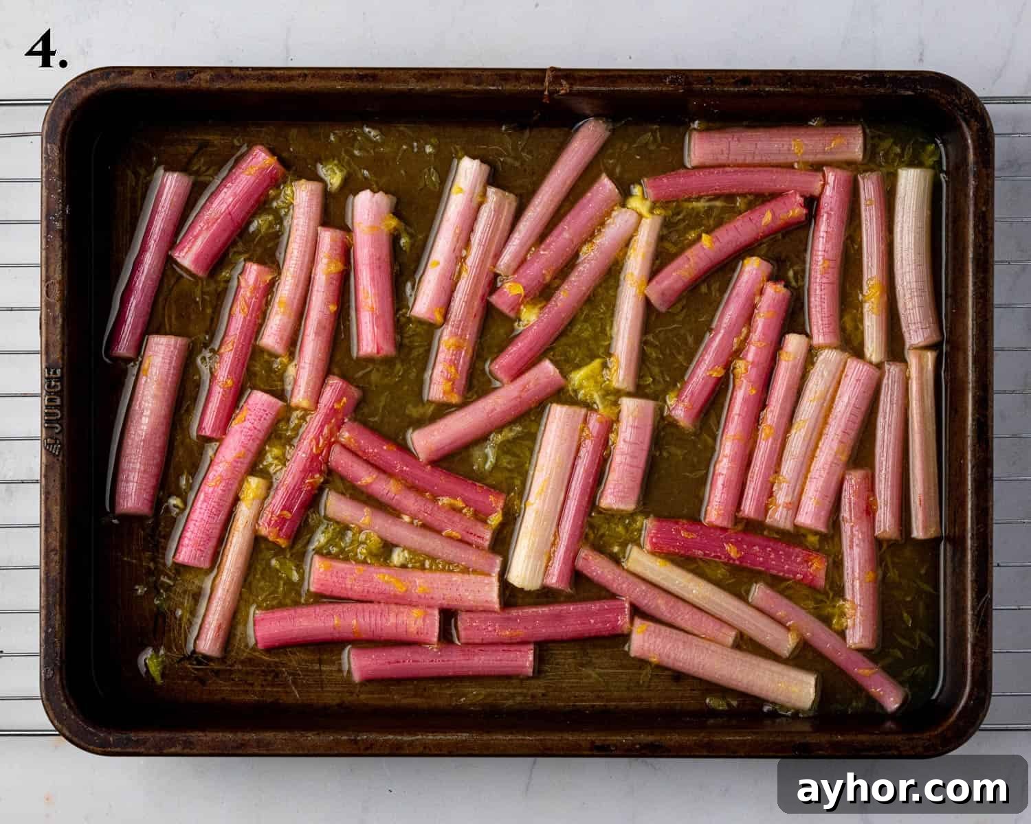 Vegan Rhubarb Frangipane Buns Recipe: Flaky Pastries with Almond Filling 8 Step 4, the roasted rhubarb on a baking sheet.