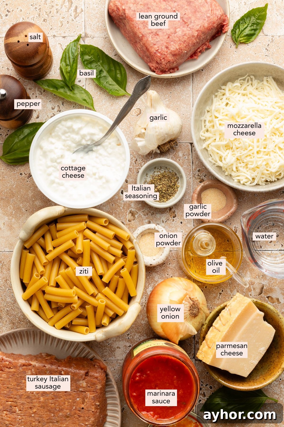 High-Protein Baked Ziti Recipe for Muscle & Meal Prep 3 Ingredients for high protein baked ziti in individual bowls with labels on a counter.