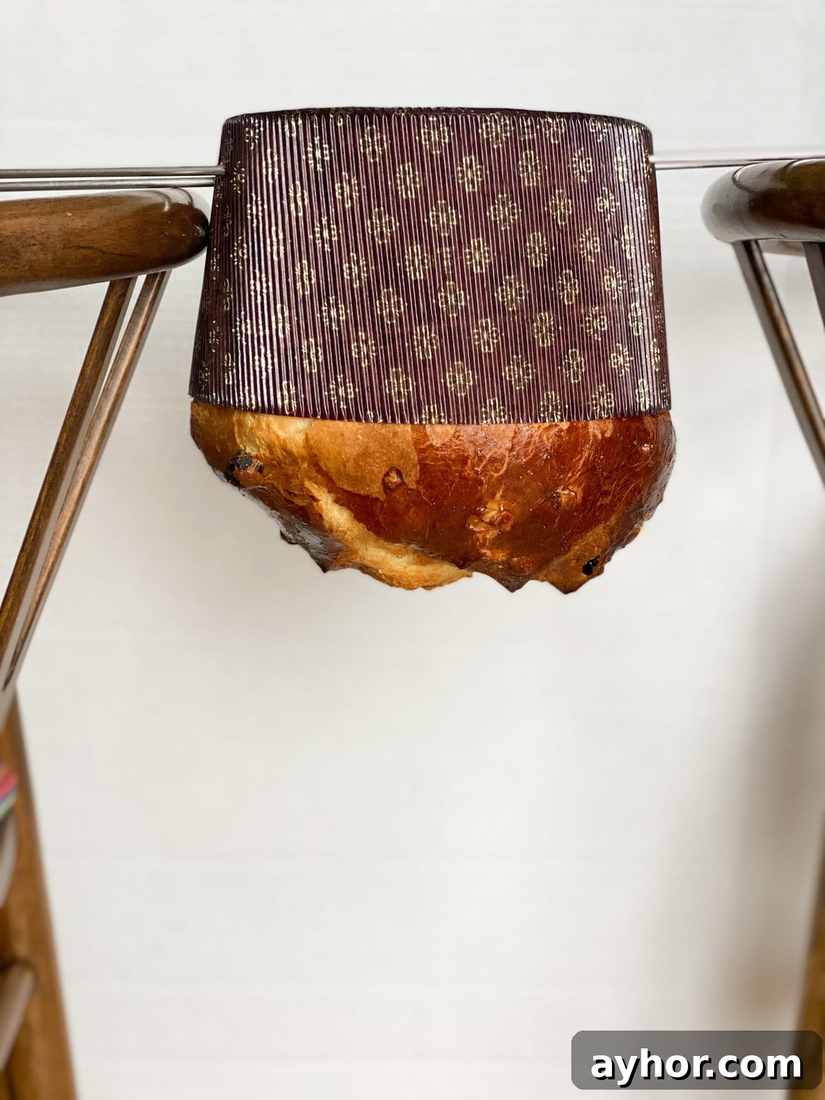 Classic Italian Panettone Recipe: Authentic Holiday Sweet Bread 19 Hanging the panettone upside down to cool