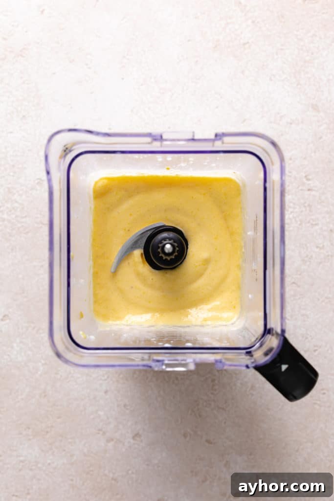 Creamy Mango Banana Smoothie Recipe for Tropical Energy 4 Smoothie in a blender.