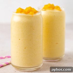 Creamy Mango Banana Smoothie Recipe for Tropical Energy 6 Fruit smoothie in a tall glass.