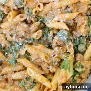 This Sausage and Butternut Squash Pasta features a creamy, lightened up pasta sauce, fresh kale and browned Italian sausage. This is the perfect family friendly dinner recipe that is ready in about 30 minutes!