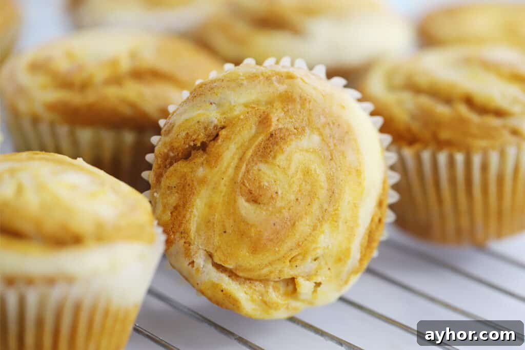 Muffins cooling on a wire rack.