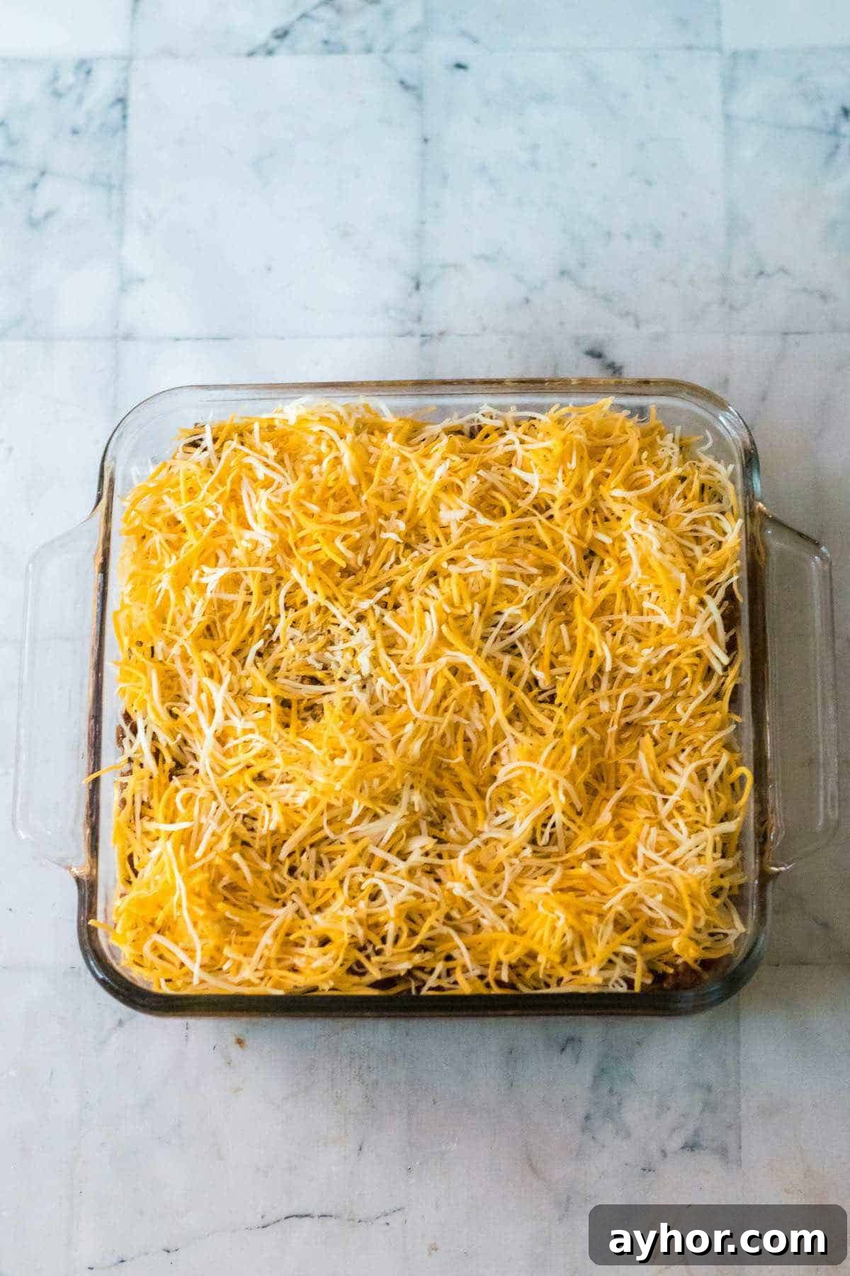 Shredded cheese on the top of the casserole before baking.