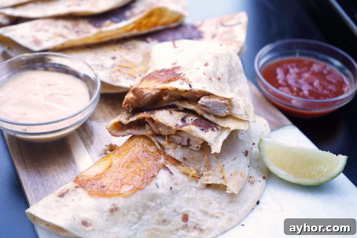 Queso chicken tacos cut in half