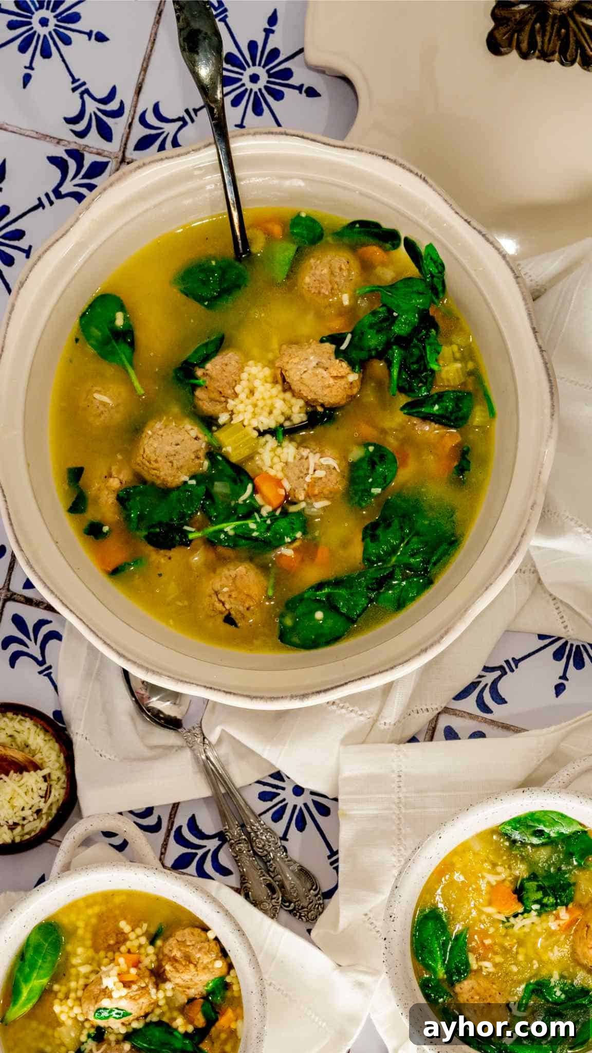 Instant Pot Italian Wedding Soup Recipe — Quick Family-Style Meal 6 A serving bowl in Instant Pot Italian Wedding Soup sitting on white linen napkins.