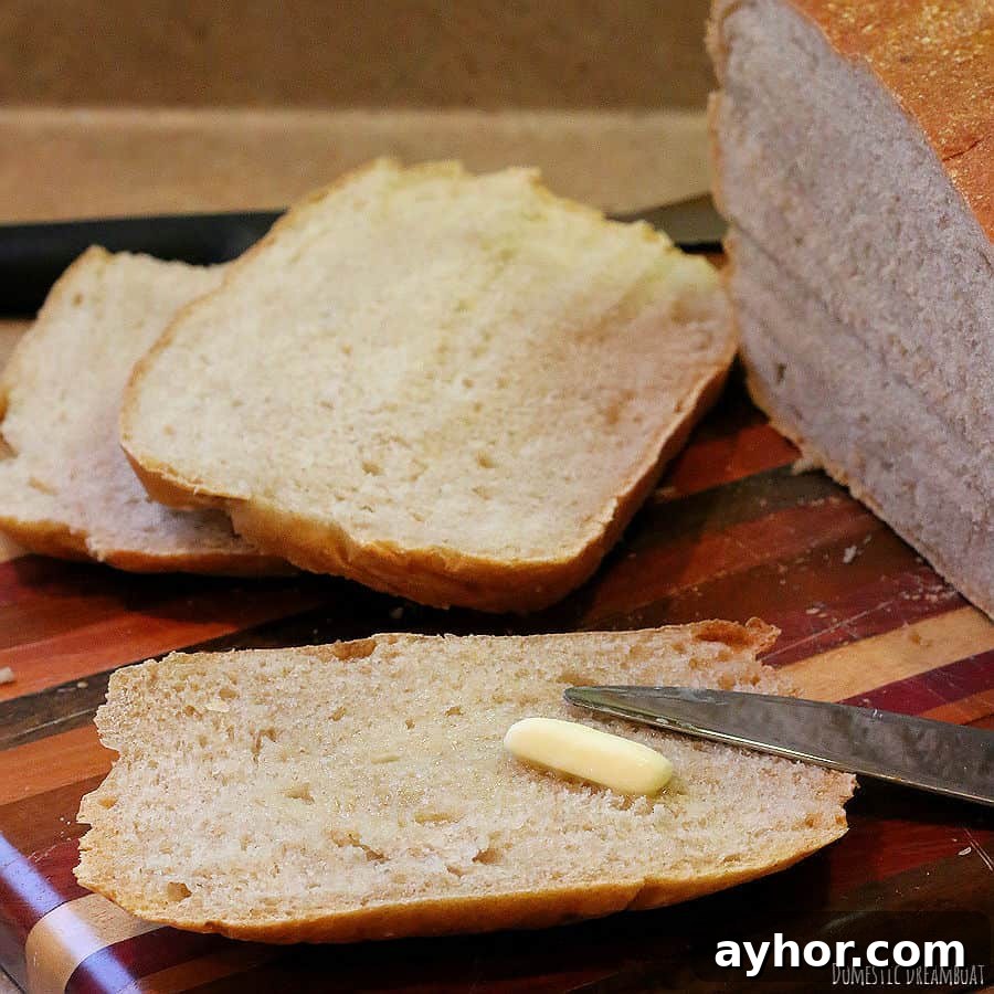No-Knead Sourdough: Simple Rustic Loaf Recipe 12 Sliced sourdough bread with butter