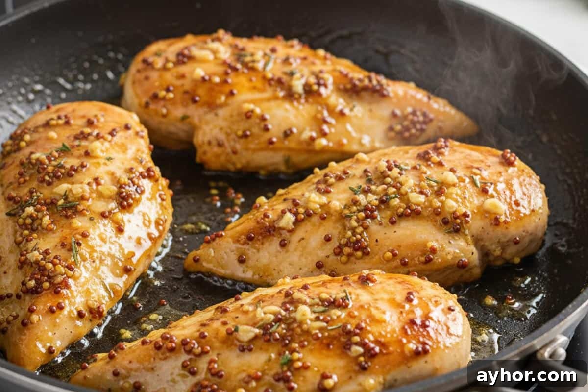  Searing chicken in a pan.
