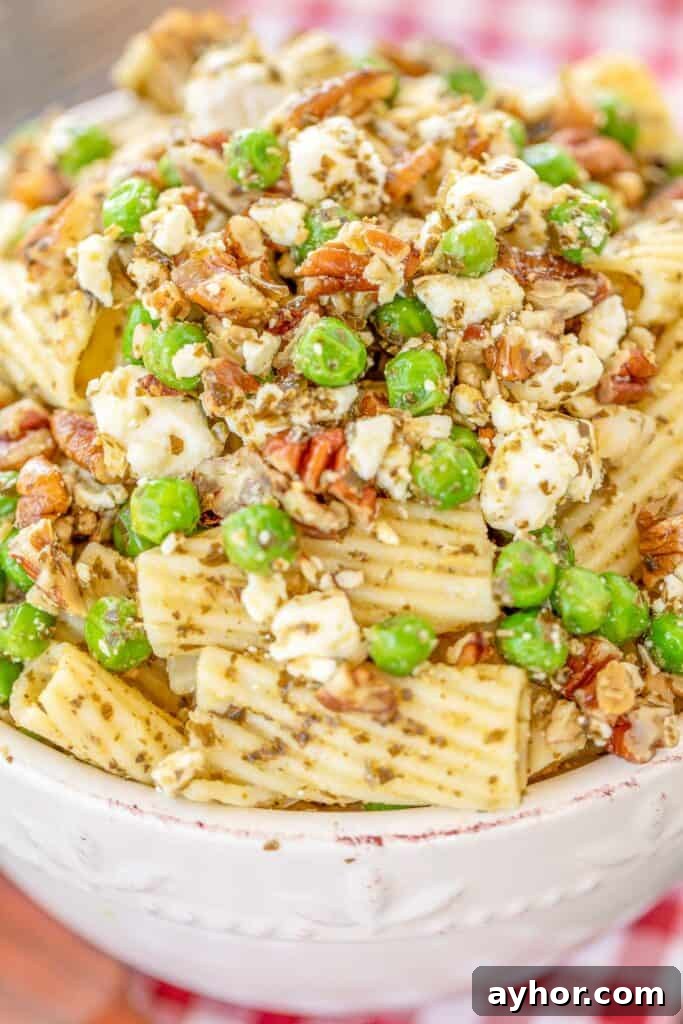bowl of pasta salad with peas and pesto