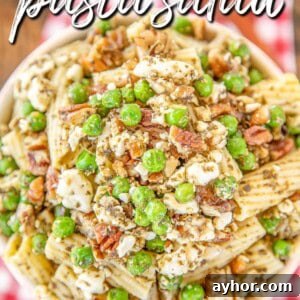 bowl of pasta salad with peas and pesto with text overlay