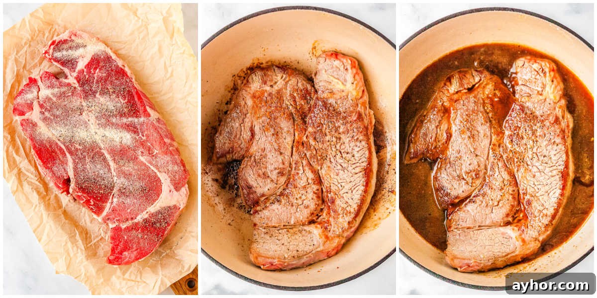 The chuck roast seasoned, braised, and placed in a heavy pot for slow cooking in the oven.