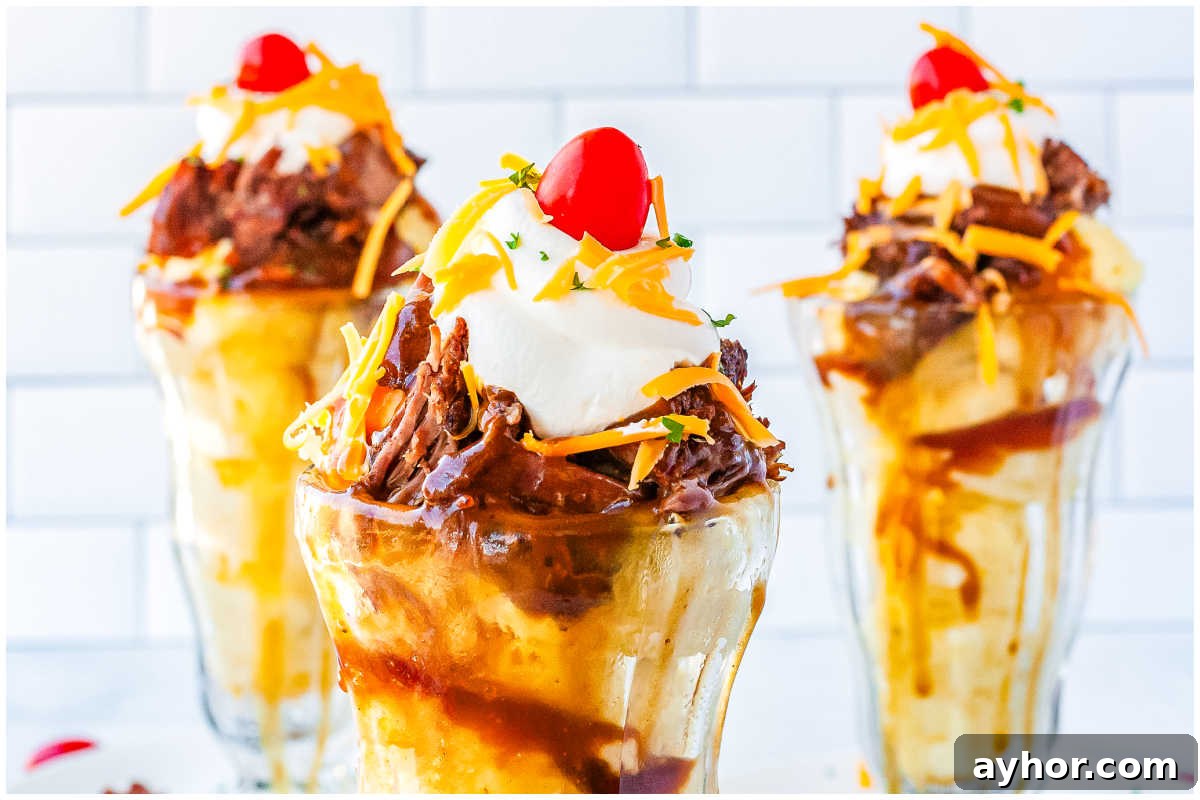 Three hot beef sundaes in tall glass sundae dishes.