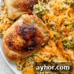 Plate of cheesy chicken broccoli and rice.