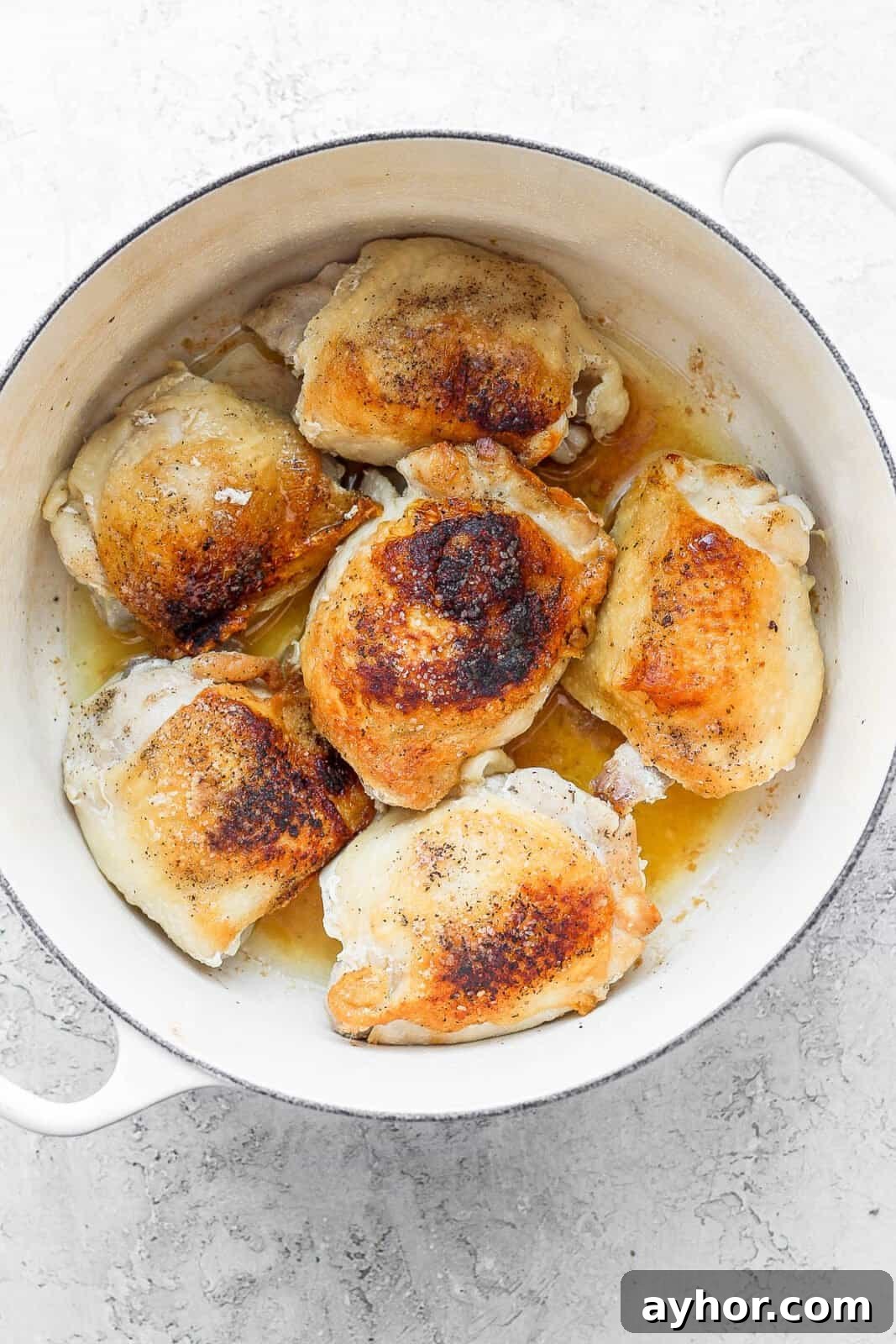 Chicken thighs seared in the dutch oven.