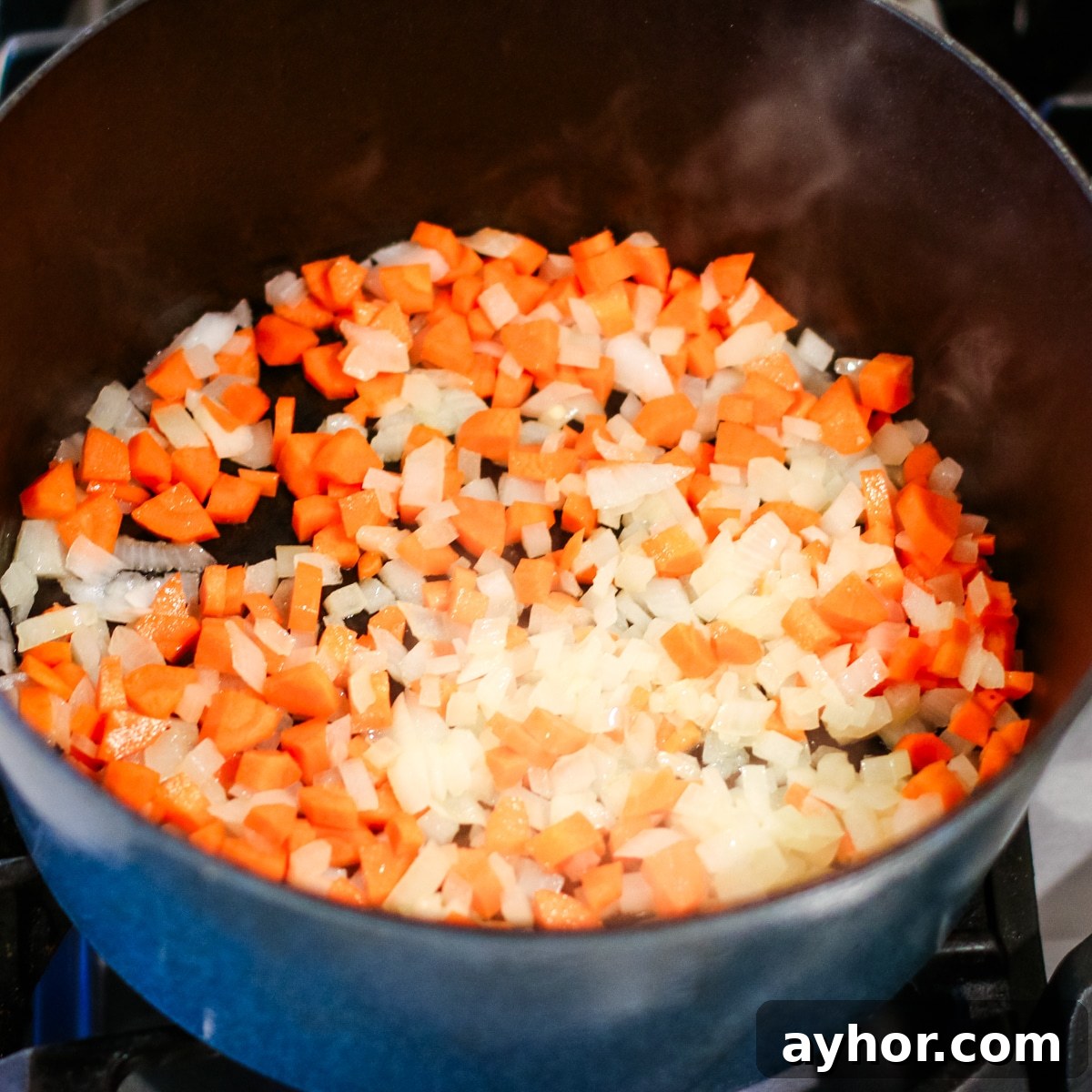 Mushroom, Rice & Turkey Soup from Leftover Roast 7 Diced onions and carrots in a pot over the stove.
