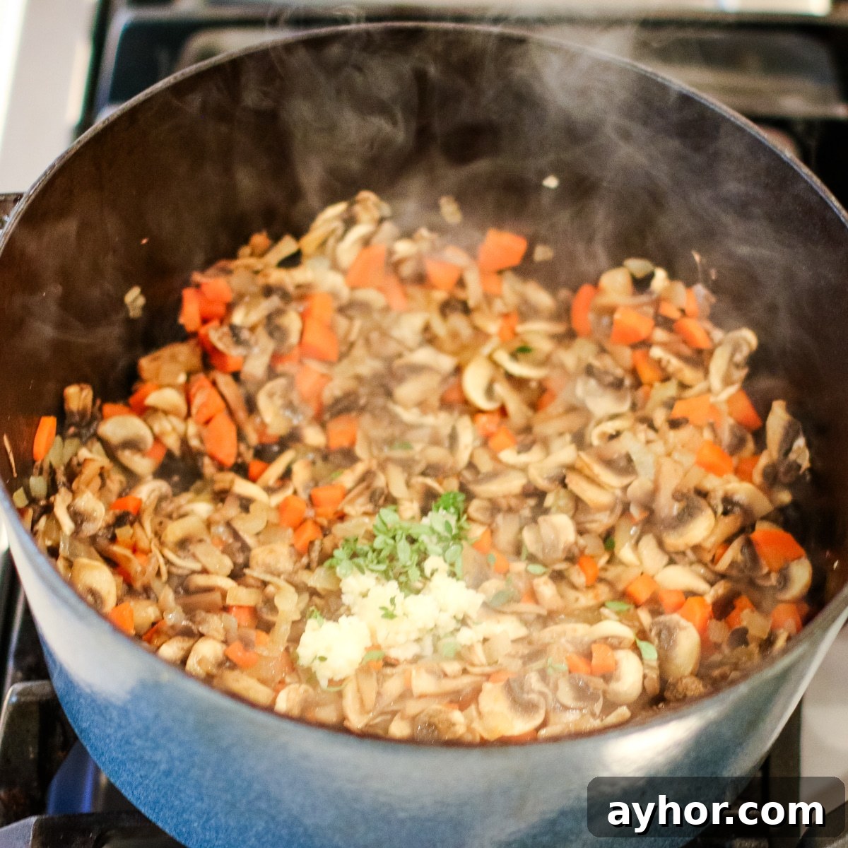 Mushroom, Rice & Turkey Soup from Leftover Roast 9 Diced onion, mushrooms, and carrots sautéed in a pot.