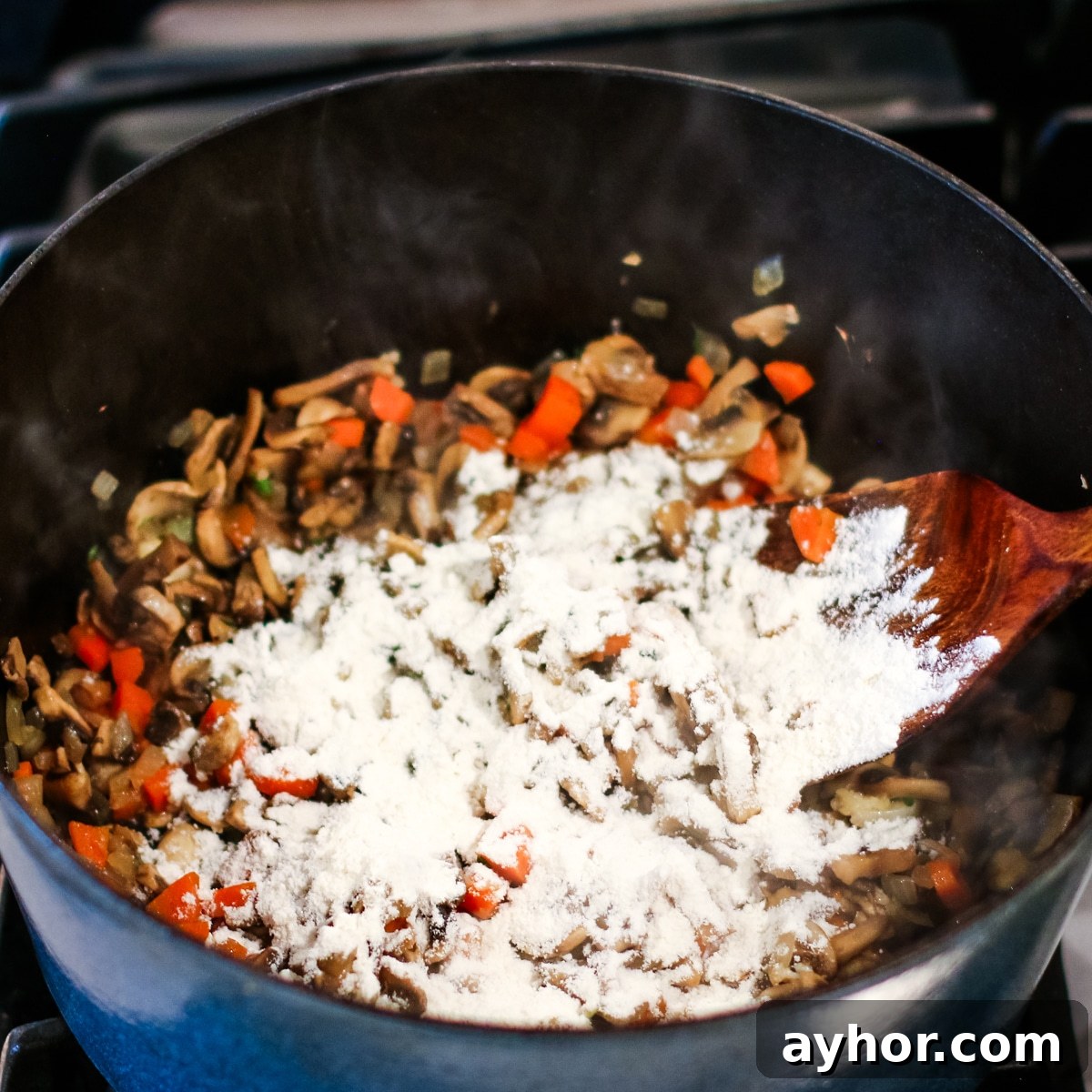 Mushroom, Rice & Turkey Soup from Leftover Roast 10 Diced onion, mushrooms, and carrots sautéed in a pot, with flour sprinkled over.