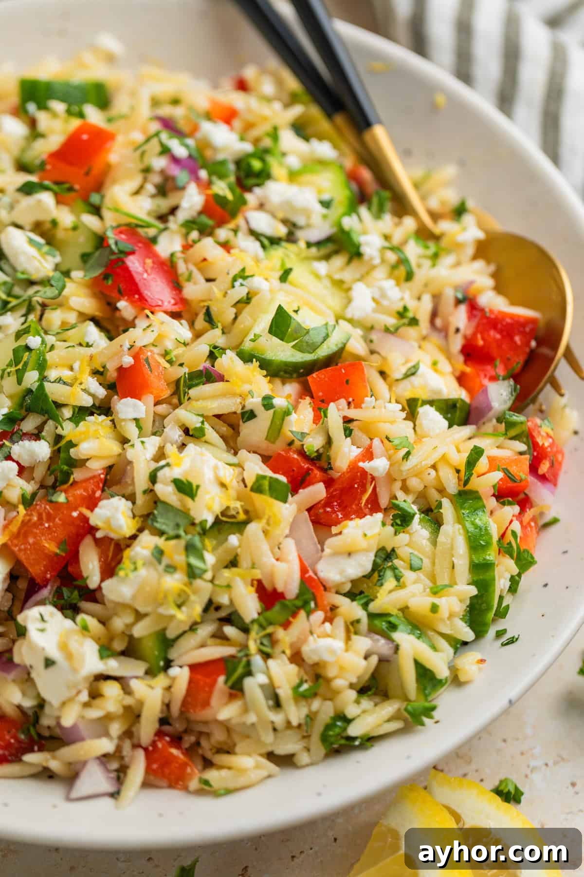 Lemon orzo salad with feta in bowl.