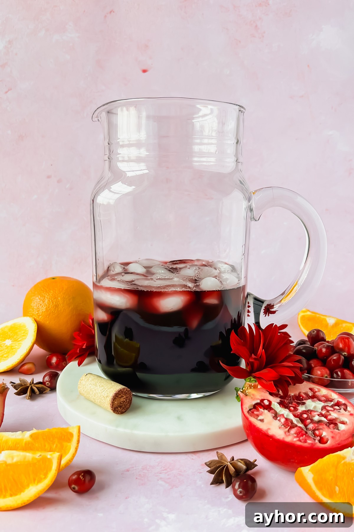 Festive Thanksgiving Sangria Recipe for Holiday Gatherings 5 wine in pitcher during process of making thanksgiving sangira.