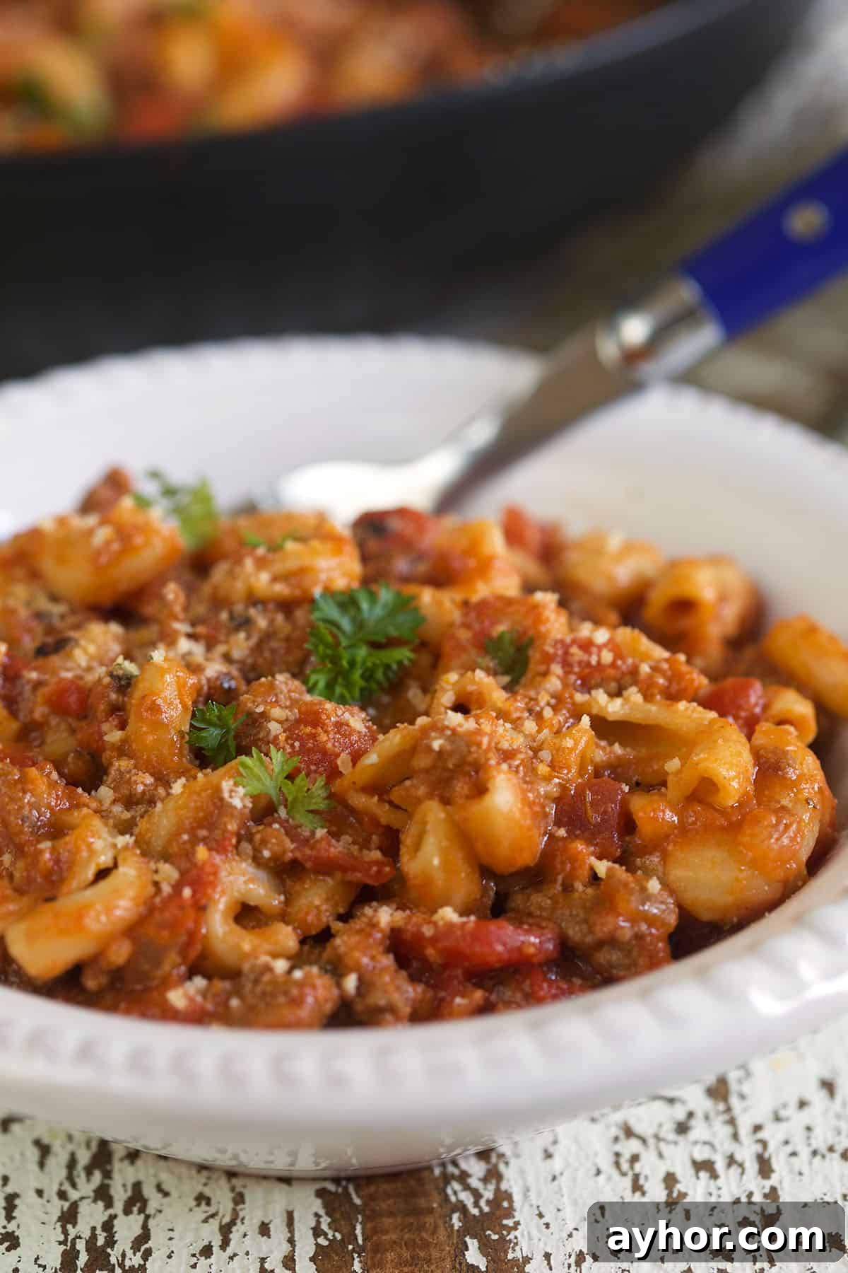 Classic American Goulash Recipe: Hearty One-Pot Comfort Meal 2 A white bowl is filled with american goulash.