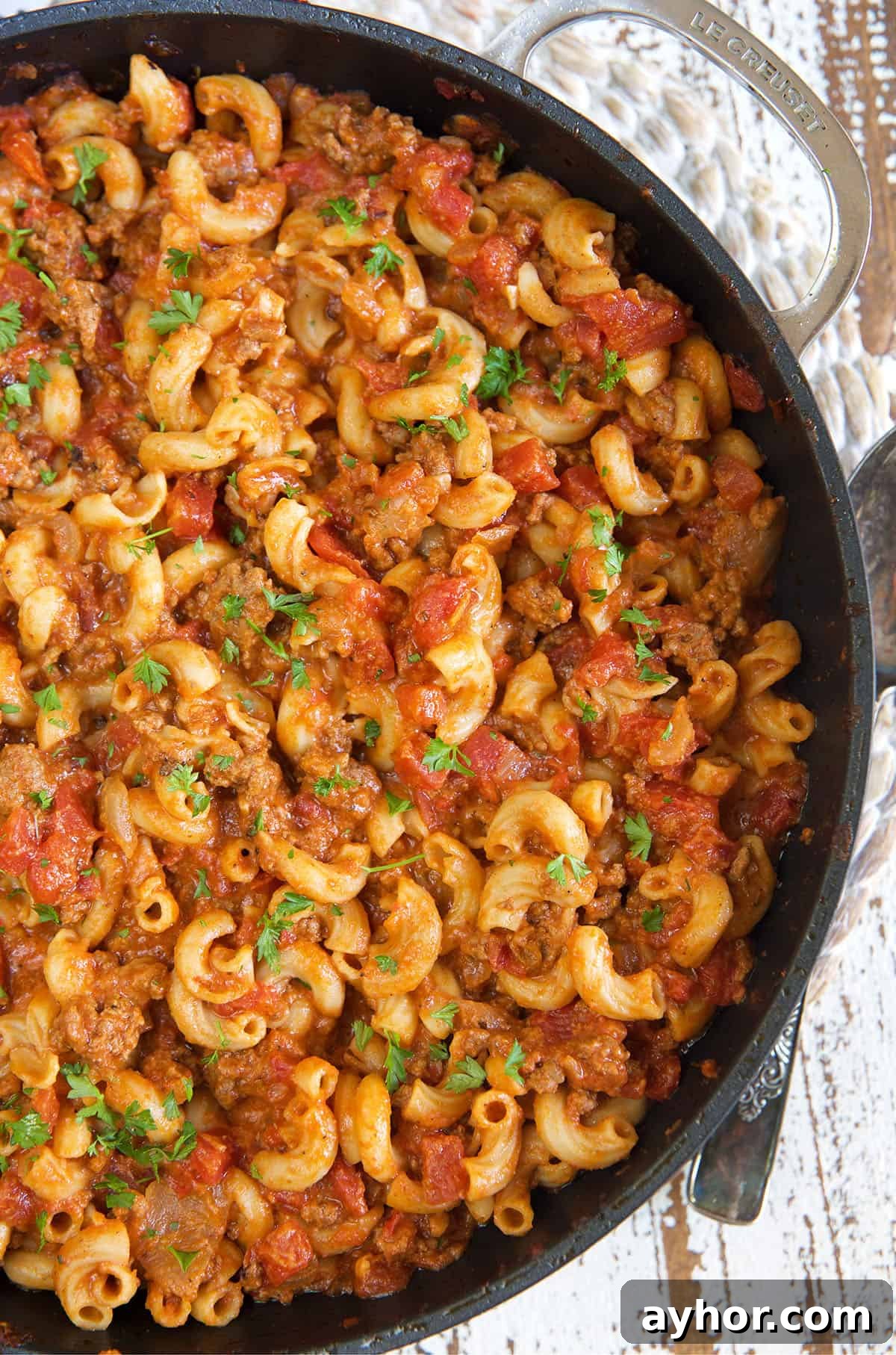 Classic American Goulash Recipe: Hearty One-Pot Comfort Meal 4 A large black skillet is filled with cooked goulash.