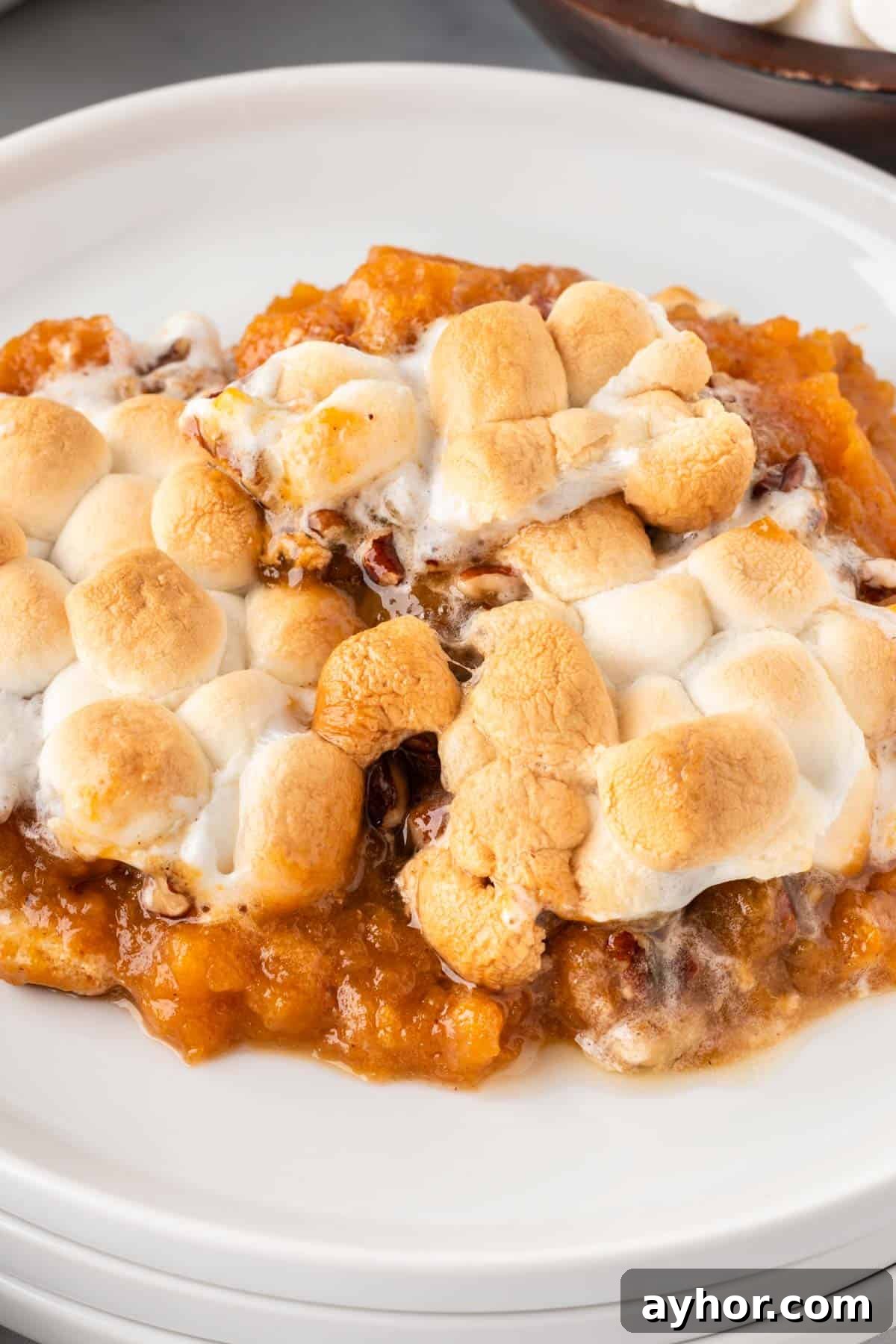 Creamy Sweet Potato Casserole with Toasted Marshmallows 20 sweet potato casserole on a plate