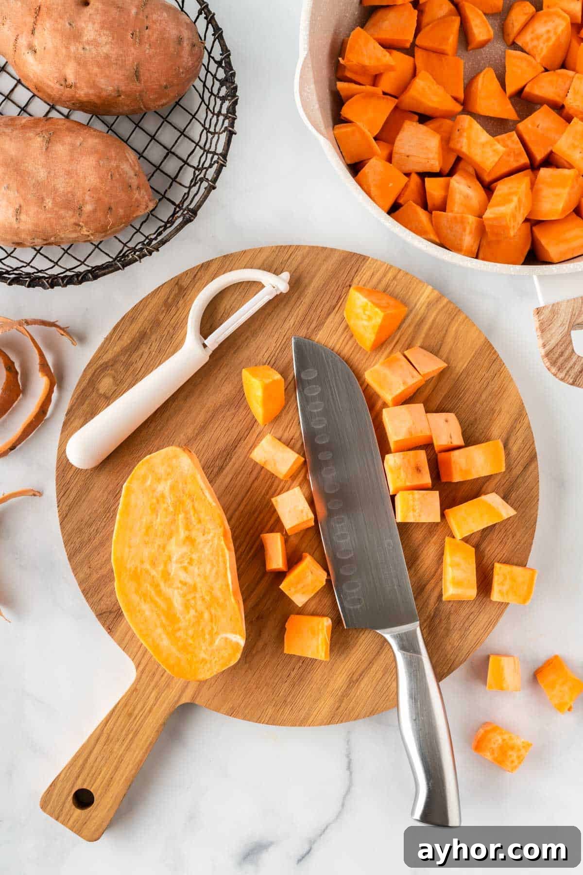 Creamy Sweet Potato Casserole with Toasted Marshmallows 5 cutting sweet potatoes into chunks