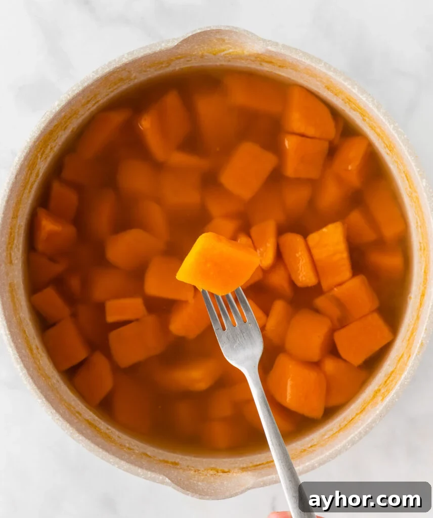 Creamy Sweet Potato Casserole with Toasted Marshmallows 7 boiled sweet potato pierced with a fork