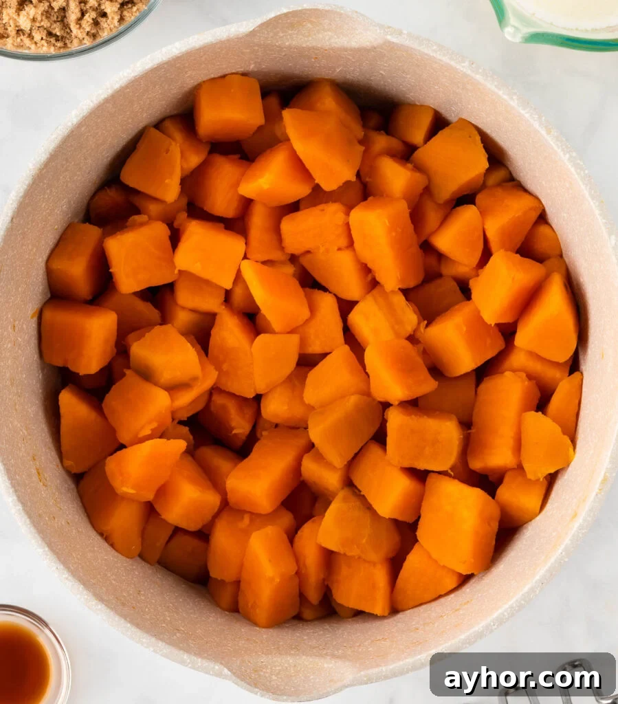 Creamy Sweet Potato Casserole with Toasted Marshmallows 8 boiled sweet potatoes in a sauce pan
