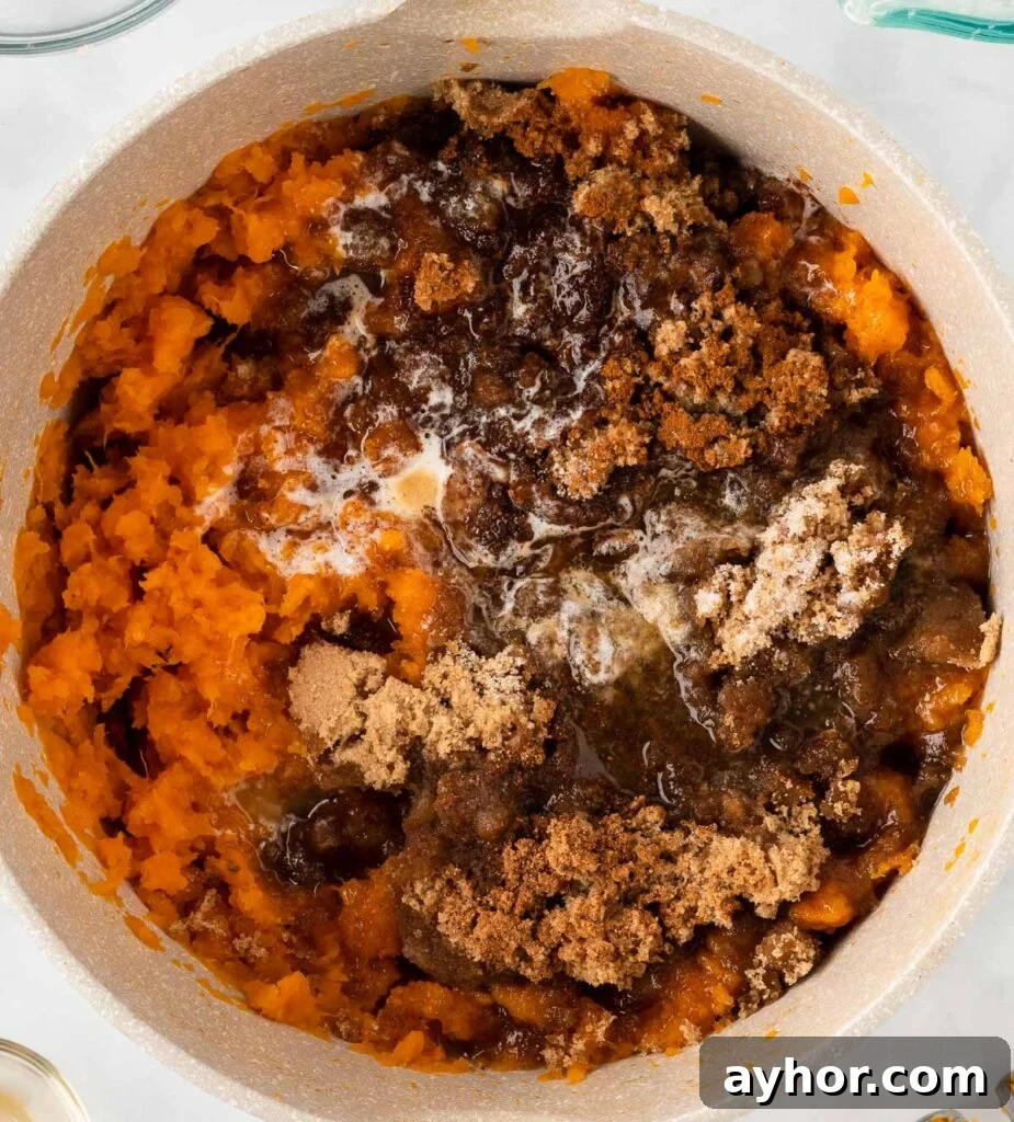 Creamy Sweet Potato Casserole with Toasted Marshmallows 10 adding the sweetener and spices to mashed sweet potatoes