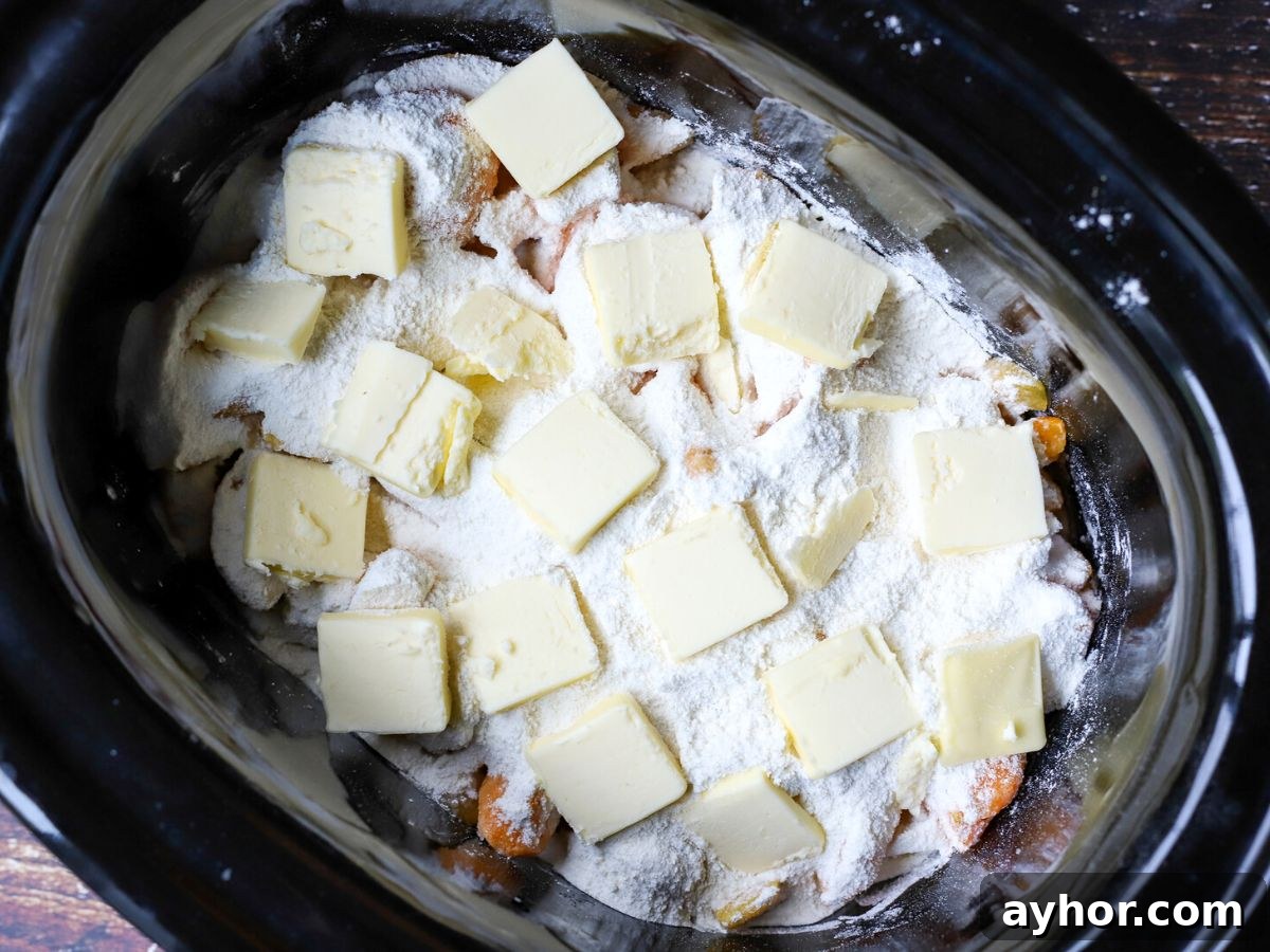 Slow-Cooker Peach Cobbler Recipe: Juicy Homemade Dessert 6 peaches with flour, sugar, and butter in crockpot