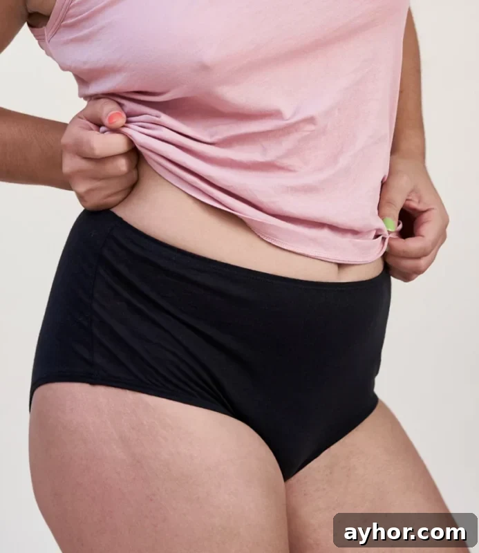 a woman wearing 100% organic cotton plus size underwear from Oddobody